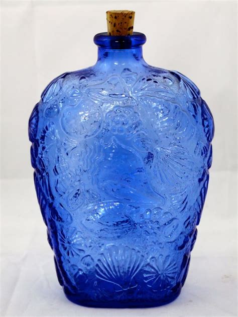Vintage Cobalt Blue Glass Bottle With Seashell Design From Etsy Blue Glass Bottles Blue