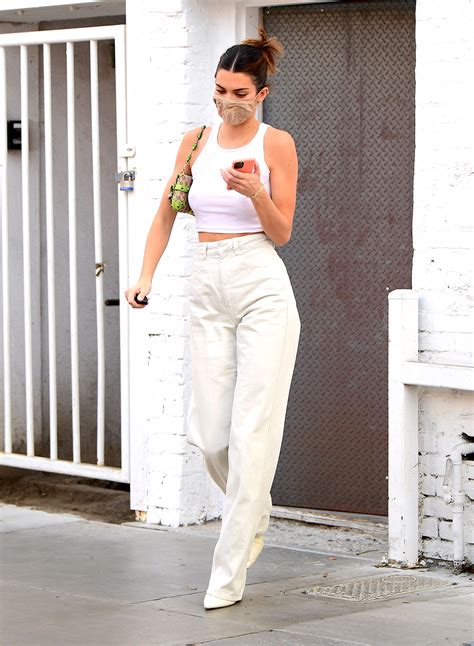 Kendall Jenner Glows In An All White Crop Top Jeans And Adidas Sneakers