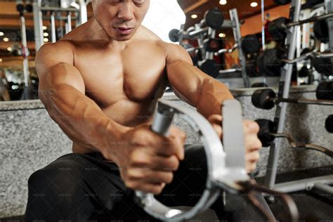 Man Building Muscles In Gym Stock Photos Motion Array