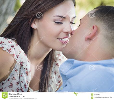 Romantic Mixed Race Couple Kissing In The Park Royalty