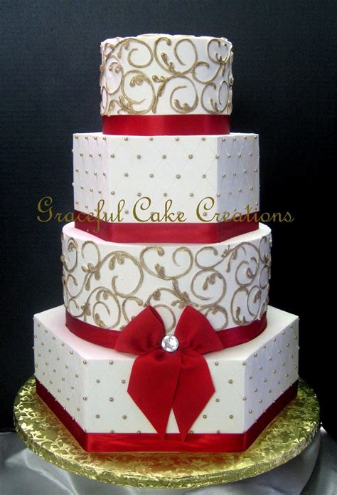 Elegant White Butter Cream Wedding Cake With Red Ribbon And Gold