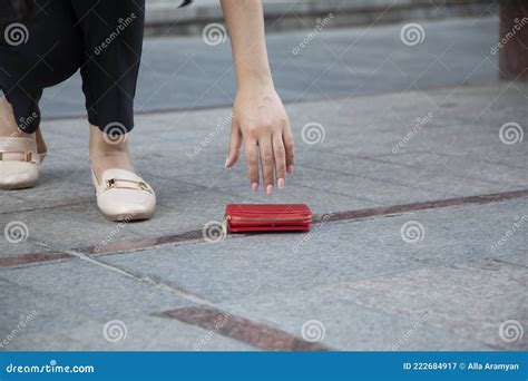 Woman And A Wallet On The Ground Stock Image Image Of Outdoors Hand