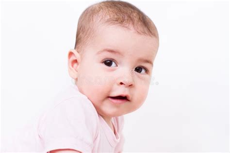Closeup Portrait Of A Beautiful Baby On White Studio Background Stock