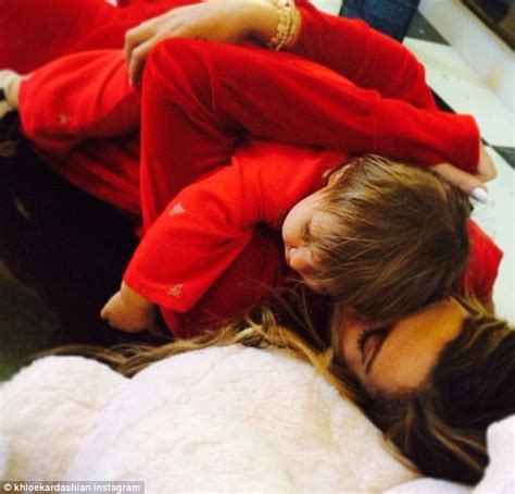 Khloe Kardashian And Kendall Jenner Snuggle Up In Red Onesies Daily