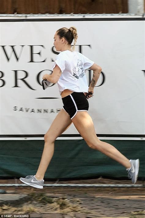 miley cyrus pulls on her shorts for a run daily mail online