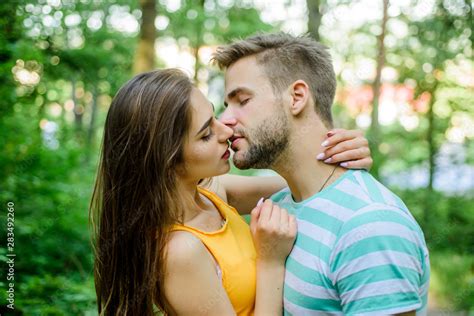Couple In Love Kissing With Passion Outdoors Man And Woman Attractive