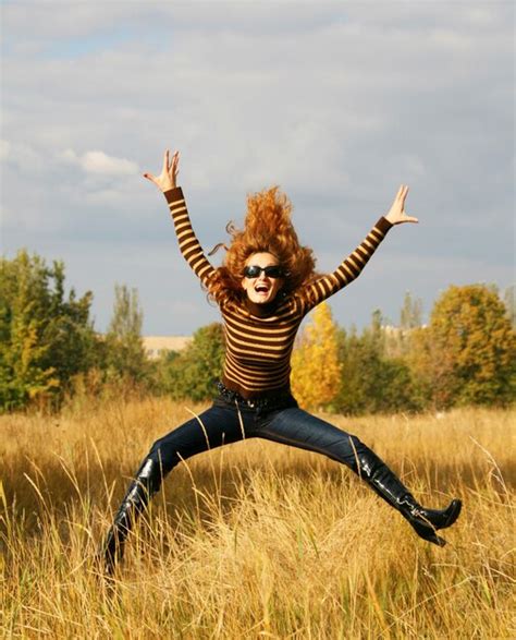 Premium Photo Jumping Young Woman In Autumn Park