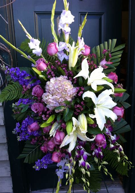 How's that for a wonderfully wintery surprise? Standing spray Love the colors … | Funeral flower ...