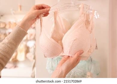 Woman Choosing Bra Lingerie Store Closeup Stock Photo