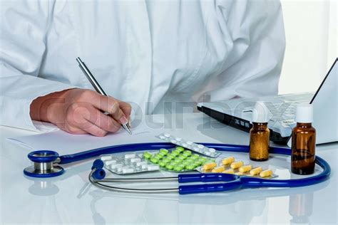 doctor prescribes a drug stock image colourbox