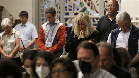 Hundreds comfort one another, grieve together at Mass after shooting