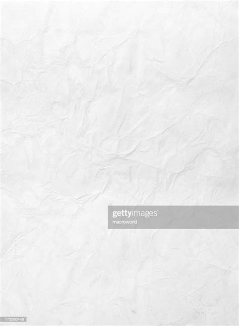 Wrinkled Piece Of Paper Against A White Background High Res Stock Photo