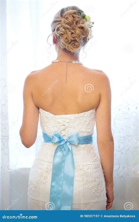 Back Of Bride In Wedding Dress With Blue Ribbon Stock Image Image Of