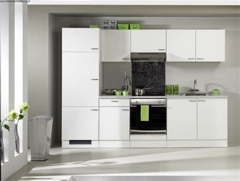 Minimalist White Avanti Compact Kitchen Design With Black Accent Of Modern Stove Top And Floor To Ceiling Window 