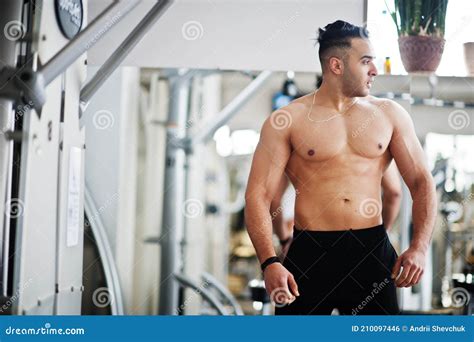 Muscular Arab Man Training In Modern Gym Fitness Arabian Men With Naked Torso Doing Exercises