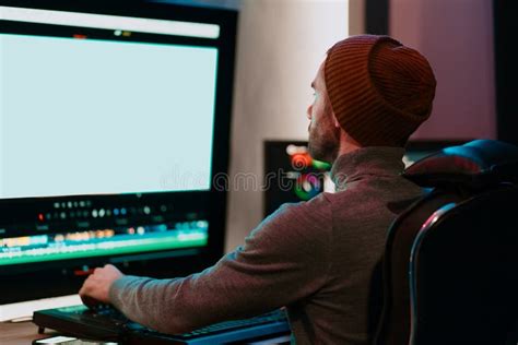Male Video Editor Working On His Personal Computer With Big Blank
