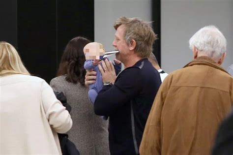 Daniel Craig Looks Exhausted As He Cradles Newborn Daughter At Jfk