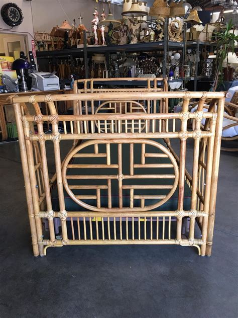 This geometric styled bed has a rattan headboard and a maple bed frame. Oriental Style High Grange Pole Rattan Twin Size Sleigh ...