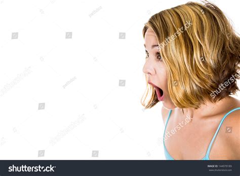 Side View Close Up Portrait Of Surprised Shocked Beautiful Girl In Amazement And Open Mouthed