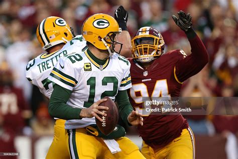 Quarterback Aaron Rodgers Of The Green Bay Packers Is Sacked For A