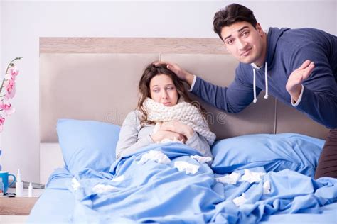 The Wife Caring For Sick Husband At Home In Bed Stock Photo Image Of