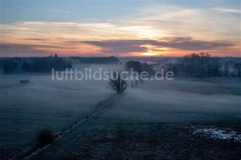Luftaufnahme Wörth am Rhein Sonnenaufgang über einem nebligen Feld in