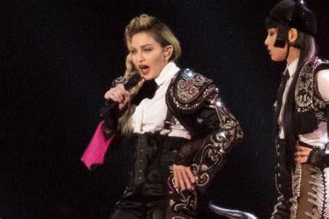 Madonna Exposes Fans Breast During Gig