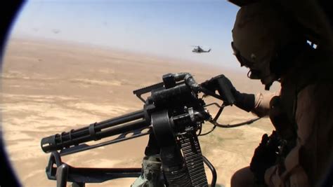 Anti Missile Flares Shot From Helicopter As Door Gunner Looks Over