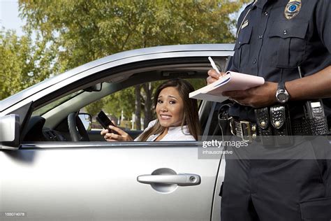 Police Officer Writing A Traffic Ticket High Res Stock Photo Getty Images