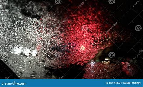 Blurry Water Drops With Street Lights Reflection In Glass Stock Image