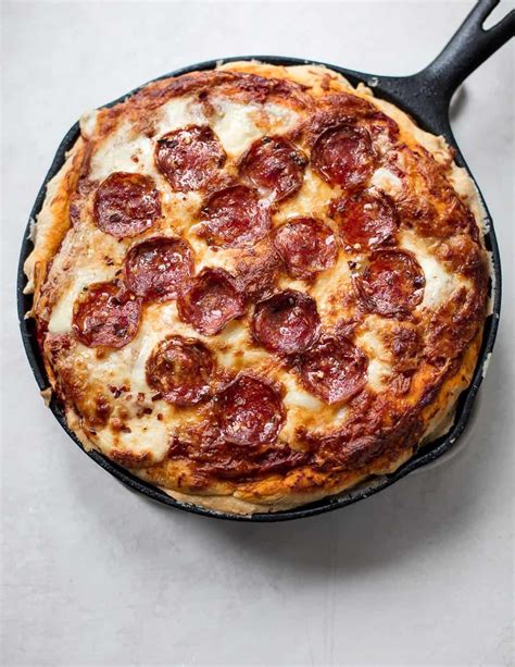 A Double Crusted Deep Dish Pizza Baked In A Cast Iron Skillet And