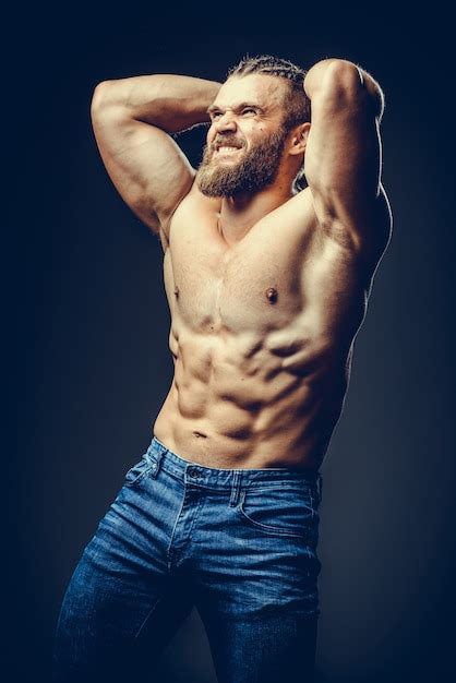 Premium Photo Portrait Of A Athleltic Muscular Bearded Man Posing