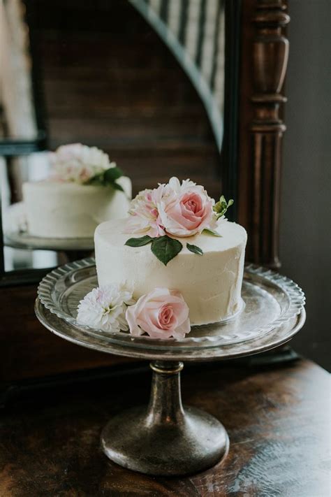 Romantic White And Blush Wedding Cake Decorated With Pink Roses