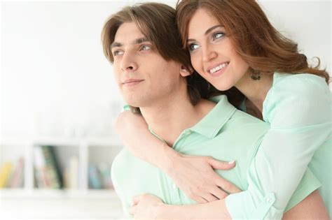 Premium Photo Portrait Of A Beautiful Young Couple Hugging