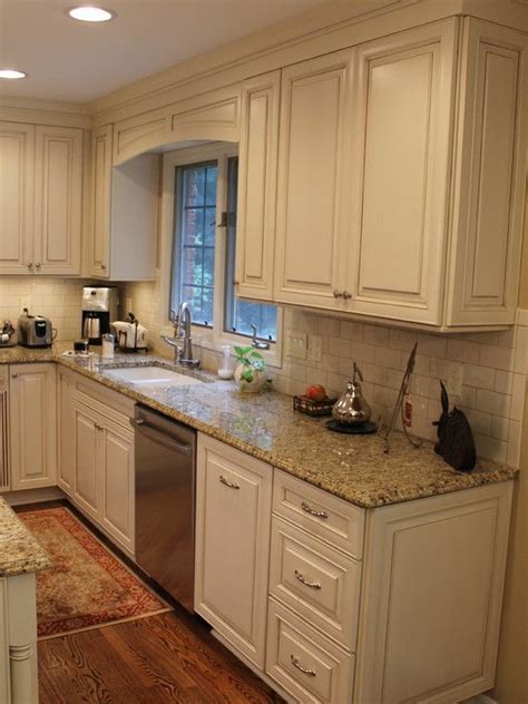 Maybe you would like to learn more about one of these? cream cabinets with Cocoa Glaze NVG Granite white subway ...