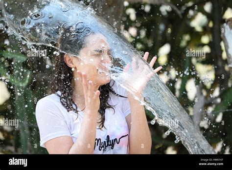 Woman Getting Splashed Of Water On The Face Stock Photo Royalty Free Image Alamy