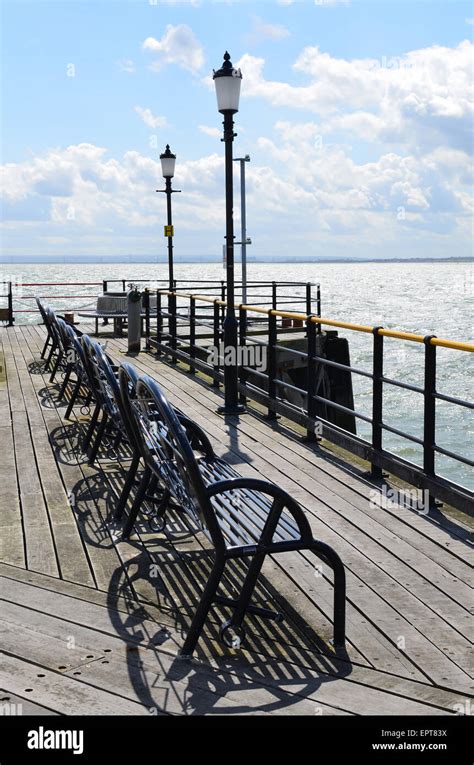 Row Of Wrought Iron Benches At The End Of Southend Pier In Essex