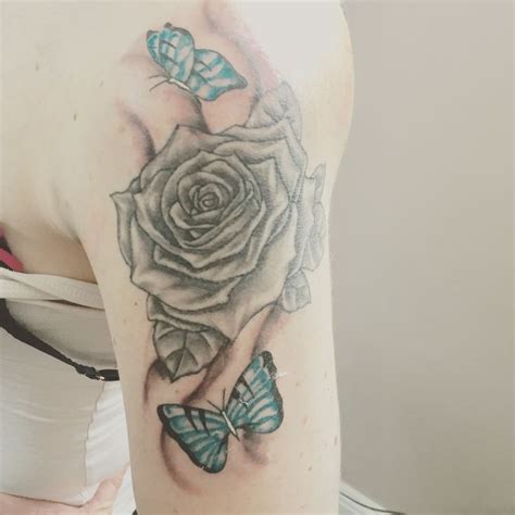 Rose Tattoo And Blue Butterflies Tattoos Rose Tattoo Tattoo Designs