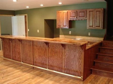 This is a great idea for a man cave, bar or den. Custom Oak Bar With Hickory Counter Top by Smith ...