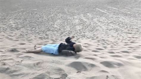 watch grandma who d never seen ocean rolls down beach during first trip metro video