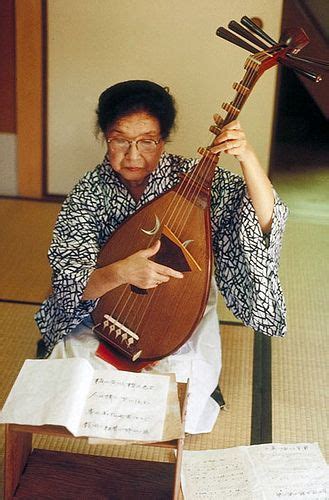 Musical instrument store menggatal tanjung aru sabah kota kinabalu. Woman playing a biwa, traditional japanese musical ...
