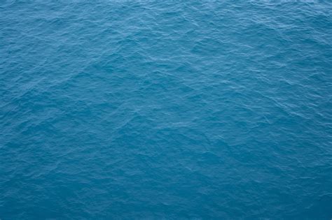 A Drone Shot Of The Blue Surface Of The Ocean Blue Paper Texture Sea