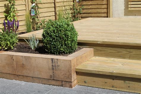 Raised Planters Using Sleepers With Decked Steps Leading To A Decked