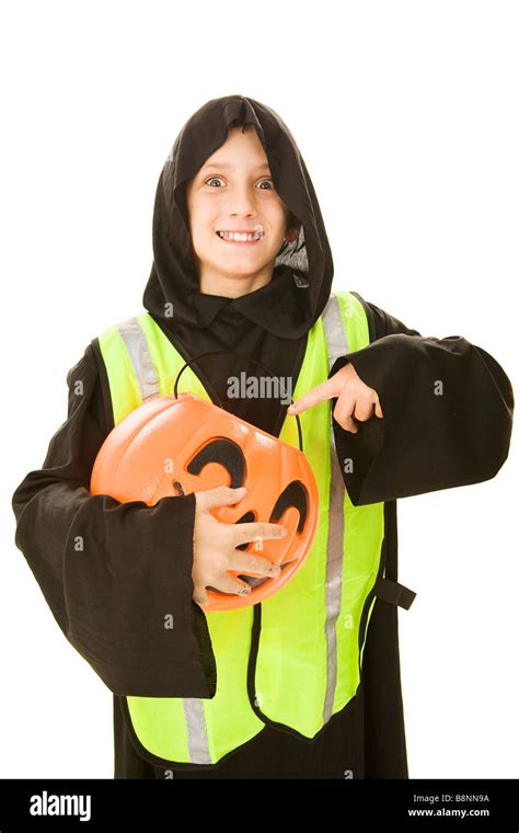 Adorable Little Boy In His Halloween Costume Wearing A Reflective Vest