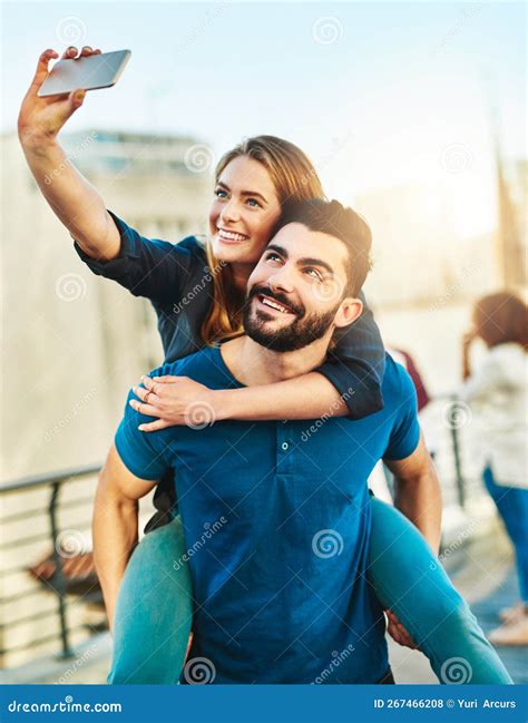 Selfies With My Sweetheart A Young Couple Taking A Selfie Outside