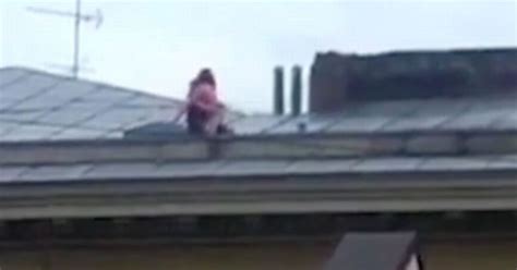 Raunchy Couple Risk Their Lives To Have Public Sex On Sloped Rooftop Of