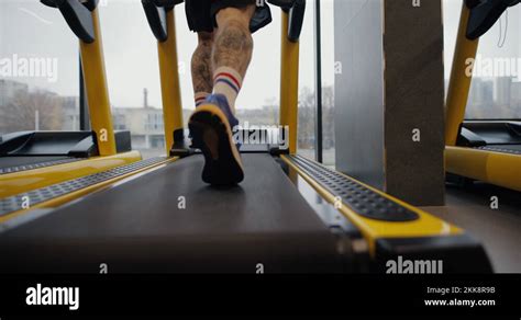 Legs Of Man Running On A Treadmill In Gym Slow Motion Stock Video