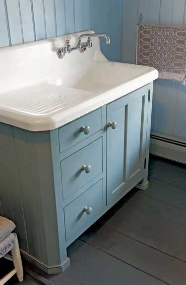 This gray double sink bathroom vanity is a single continual sink beneath two faucets, great for washing with running water but not ideal if you prefer to fill the sink. Vanities of the Bath - Old-House Online - Old-House Online