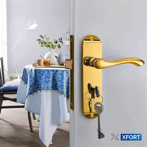 Xfort Cadenza Scroll Polished Brass Door Handles Lock Contemporary