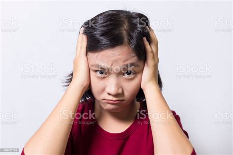 Woman Has A Headache Isolated On White Background Stock Photo
